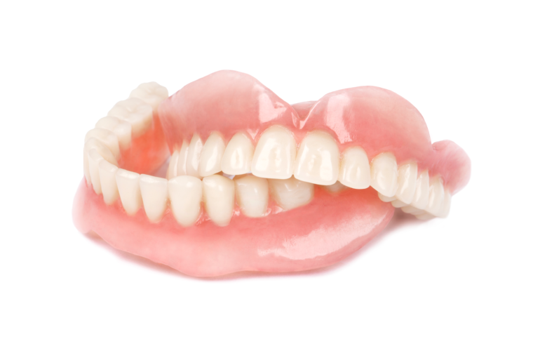 Set of dentures on white background.
